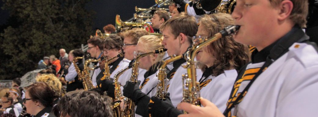Shawnee Mission West Pride Band playing at a football game
